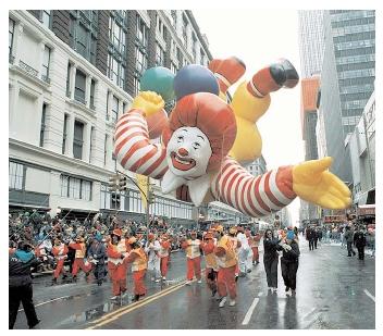 Companies often use characters to appeal to young consumers. Ronald McDonald first appeared on T.V. in 1963, portrayed by Willard Scott. The clown is known worldwide, and according to McDonald's, is the most recognizable figure next to Santa Claus. [Photograph by Tim Clary. AP/Wide World Photos. Reproduced by permission.]